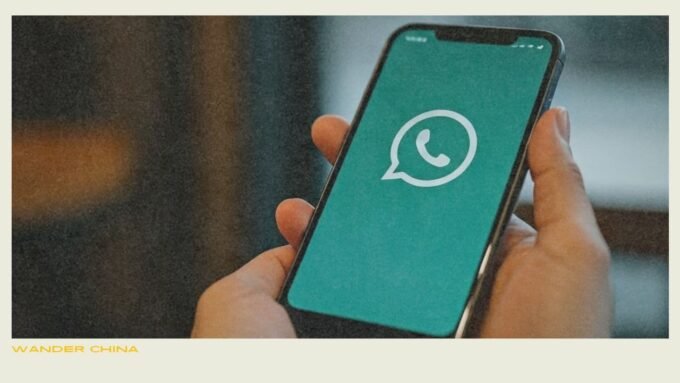 Person using smartphone with WhatsApp