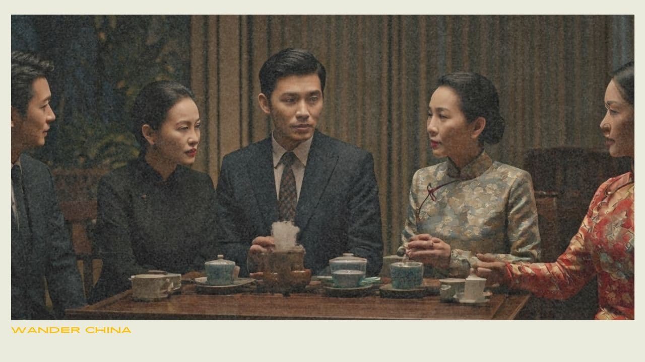 Group in formal attire at tea ceremony