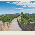 Traveler using phone at Great Wall